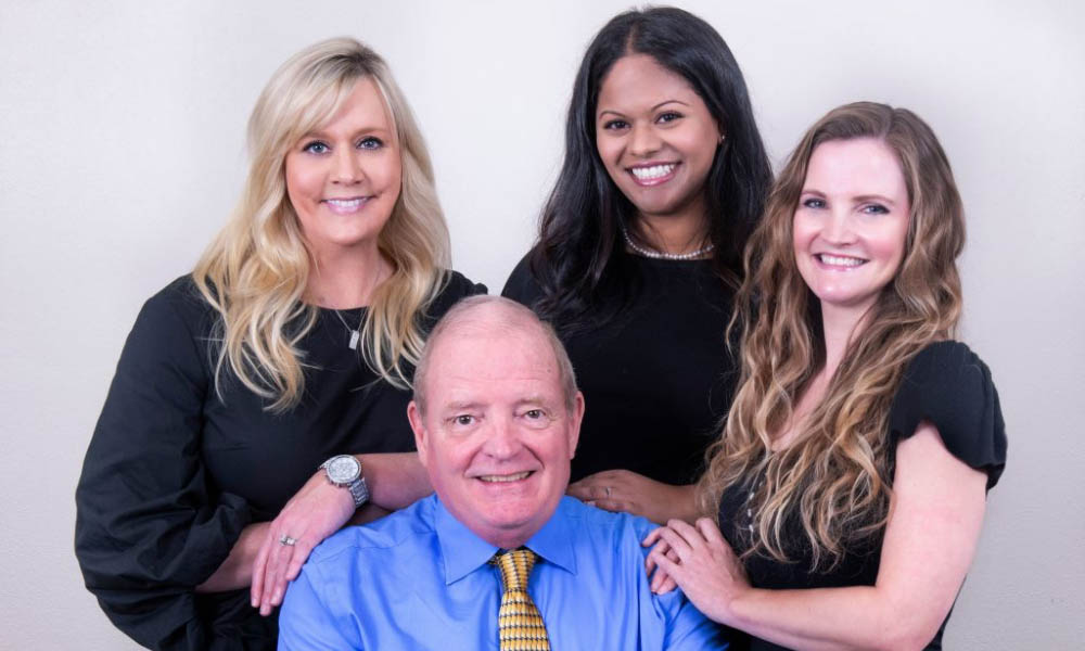 Hearing team of Texas Professional Hearing Center INC smiling together 