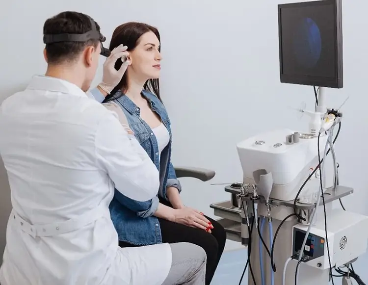 Audiologist conducts a comprehensive hearing assessment on a patient